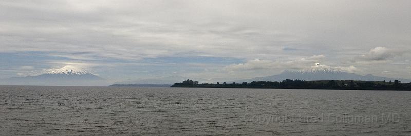 20071219 134840 D200 3900x1300.jpg - Volcano Osormo on left (a perfect cone) and Mount Calbuco on right from Puerto Varas.  Lake LLanquihue is one of the largest natural lakes in South America